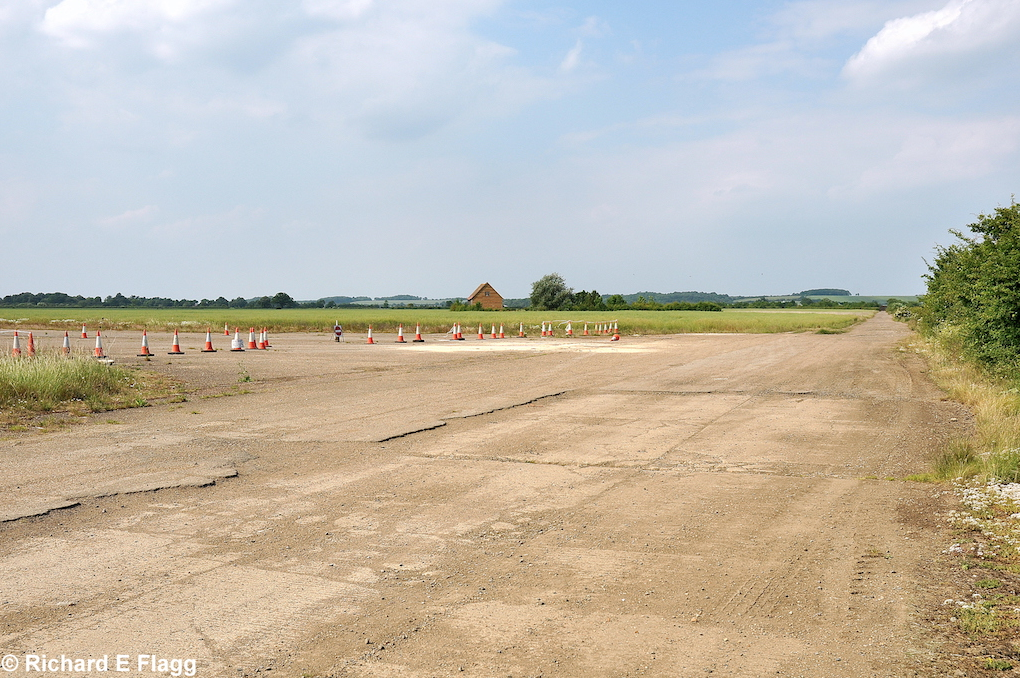 009Taxiway at the east of the airfield. Looking north at the runway 31 threshold - 26 June 2010.png