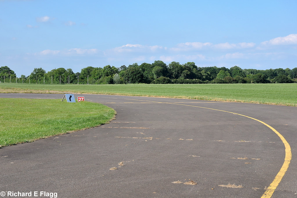 010Taxiway at the south of the airfield. Looking north towards the runway 28 threshold - 25 June 2010.png