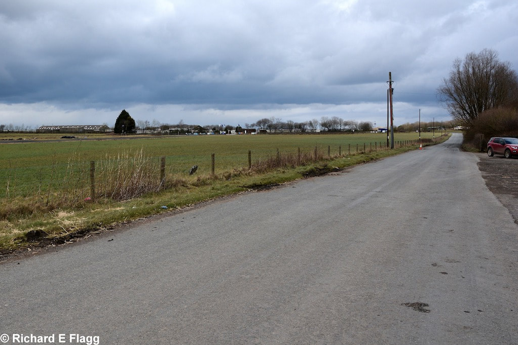 012Taxiway at the south west of the airfield. Looking east from near the memorial - 7 March 2016.png
