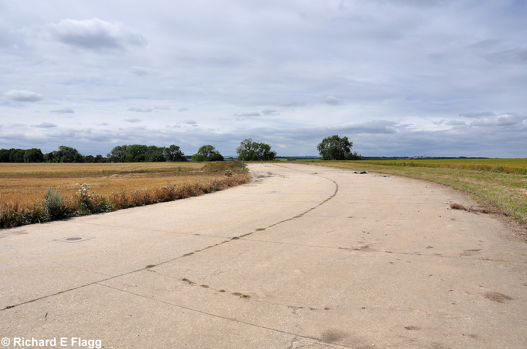 009Taxiway at the north of the airfield. Looking west at the runway 19 threshold - 24 July 2010.png