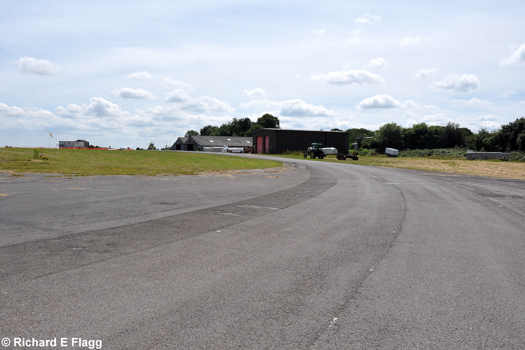 009Taxiway at the north west of the airfield. Looking south from the runway 16 threshold - 17 July 2014.png