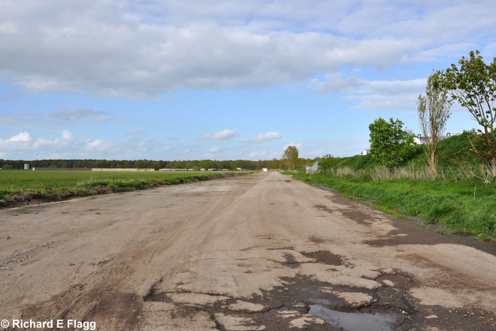 005Taxiway at the south of the airfield. Looking north east from near the control tower - 15 May 2012.png
