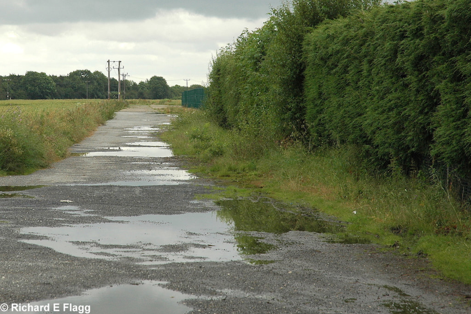 004Taxiway at the south of the airfield. Looking east from Reepham Road - 1 July 2007.png