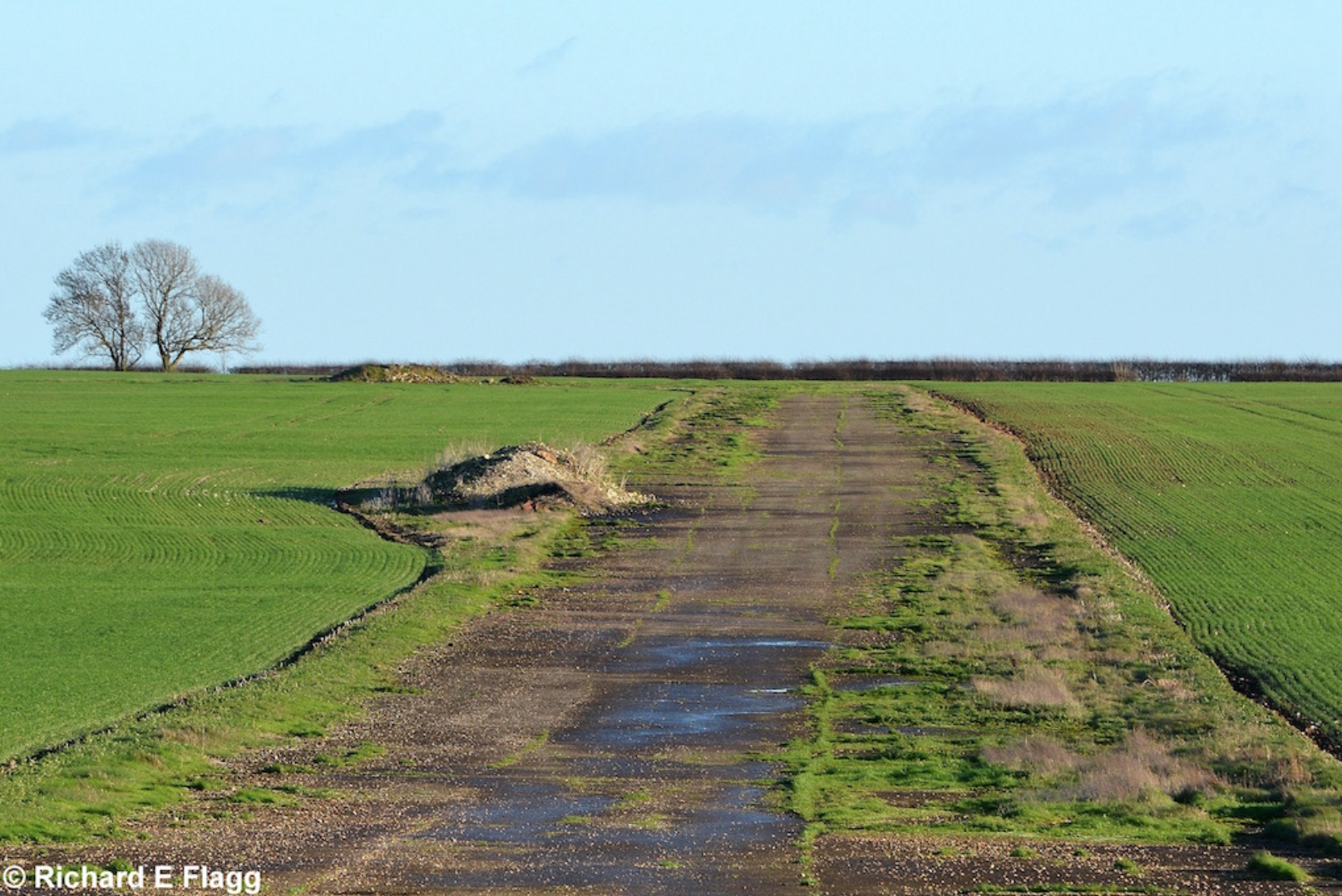 007Taxiway at the south of the airfield. Looking north east from the road that crosses the airfield - 31 December 2015.png